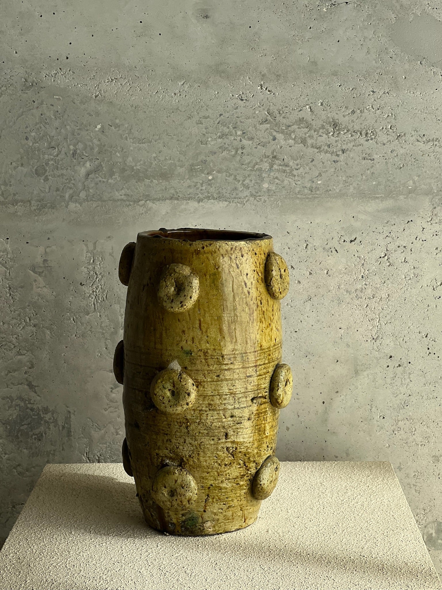 Ceramic vase with textured orbs
